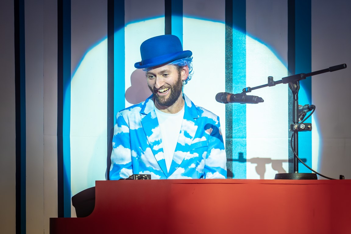 Dylan Townley (Musical Director & The Weather Man) in Rapunzel © Marc Brenner